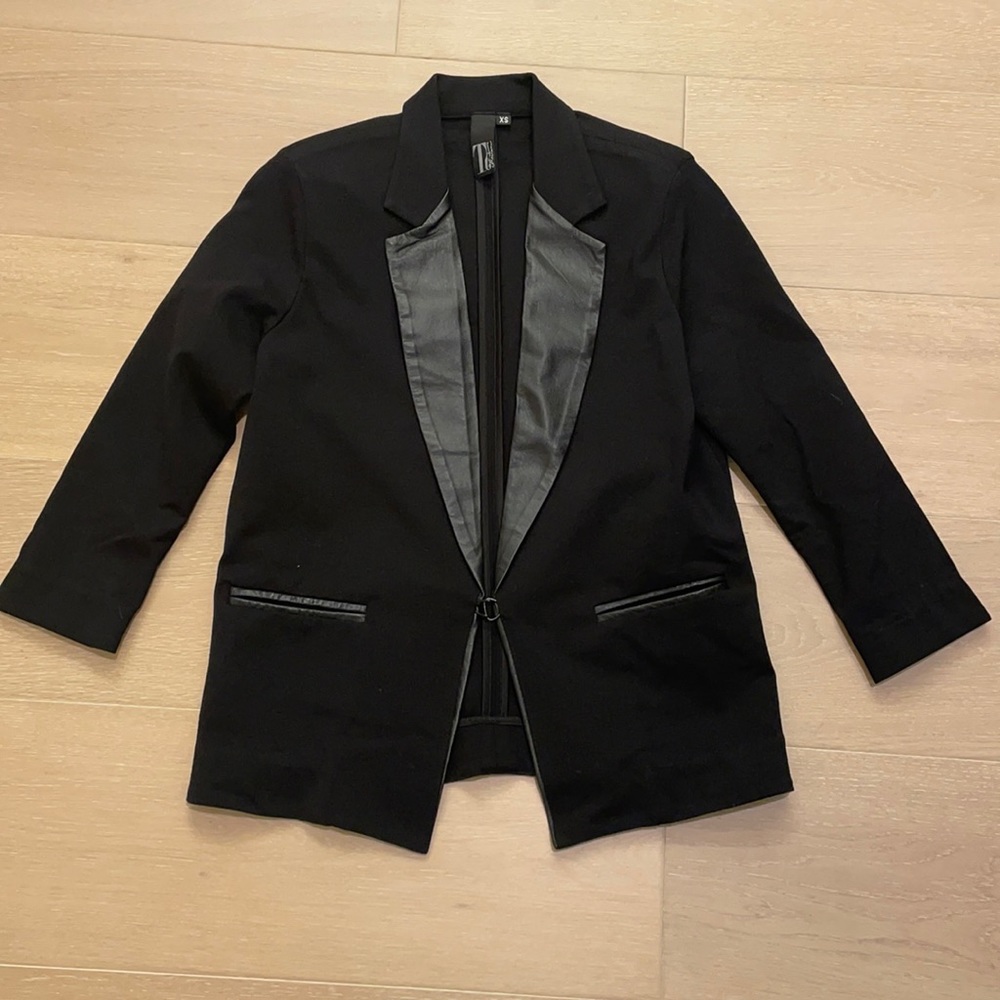 Black jacket with a real leather trim